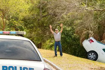 Hire car in a ditch with police there to help