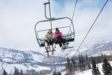 Skiers on ski lift