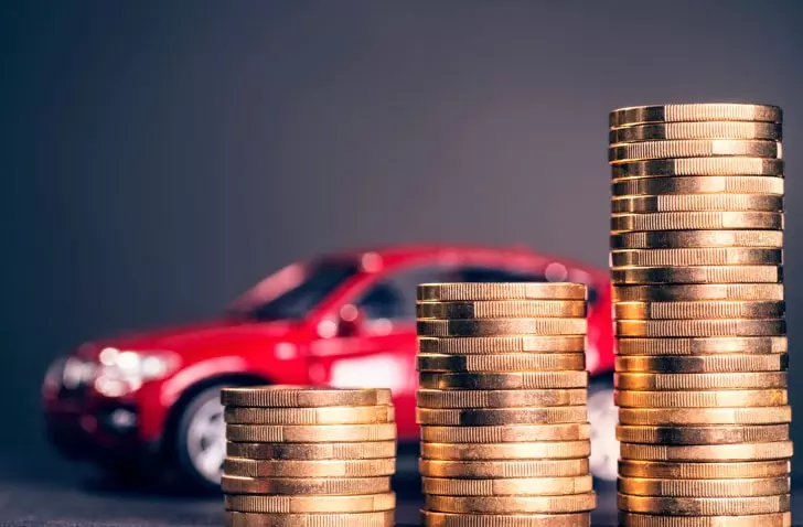 Toy car with stack of money coins